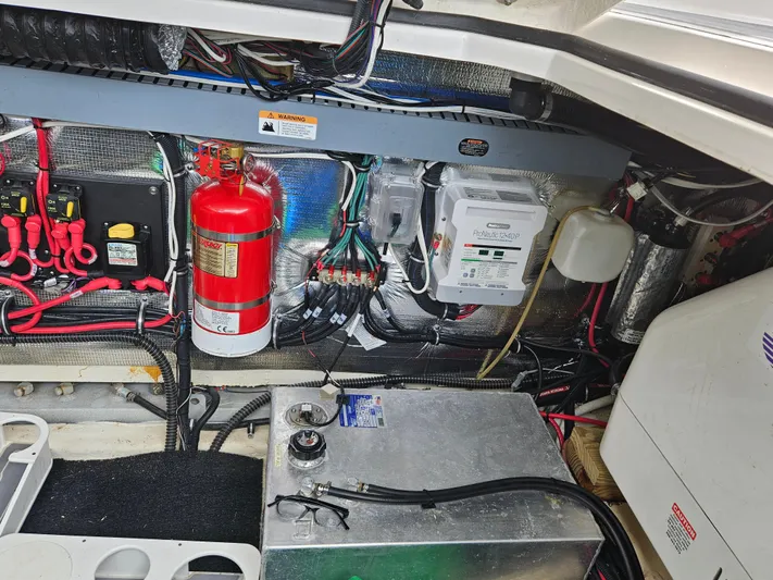  Yacht Photos Pics Engine compartment of 2022 Regal 33 XO boat with fire extinguisher and electrical components.