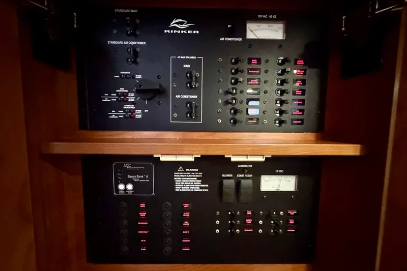 Escape Yacht Photos Pics Control panel of a 2009 Rinker 360 Express Cruiser, featuring switches and gauges.