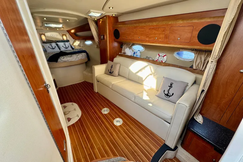 Escape Yacht Photos Pics 2009 Rinker 360 Express Cruiser interior with cozy seating and nautical decor.