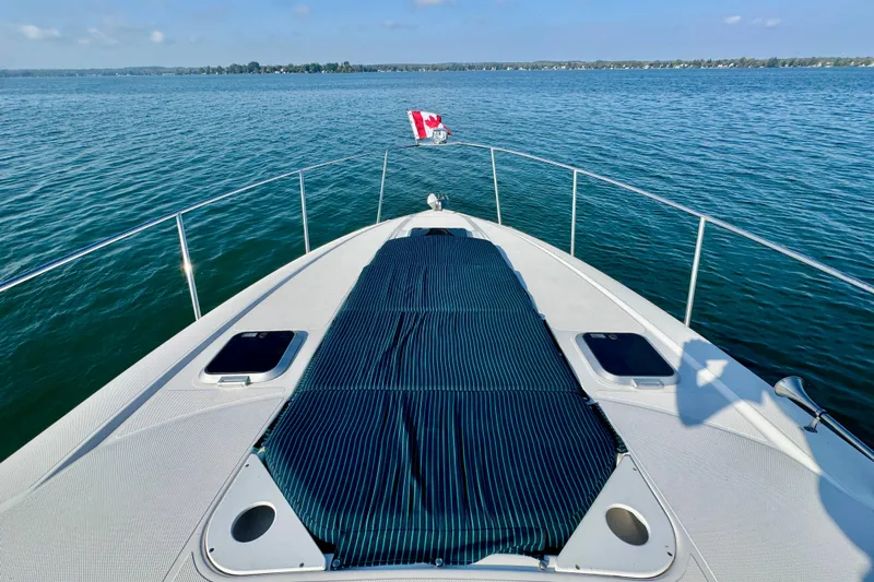 Escape Yacht Photos Pics 2009 Rinker 360 Express Cruiser on calm water with Canadian flag.