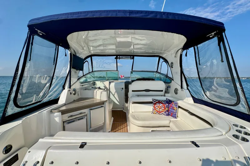 Escape Yacht Photos Pics 2009 Rinker 360 Express Cruiser interior with seating, kitchenette, and ocean view.