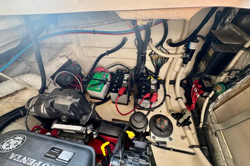 Escape Yacht Photos Pics Engine compartment of a 2009 Rinker 360 Express Cruiser with visible wiring and components.