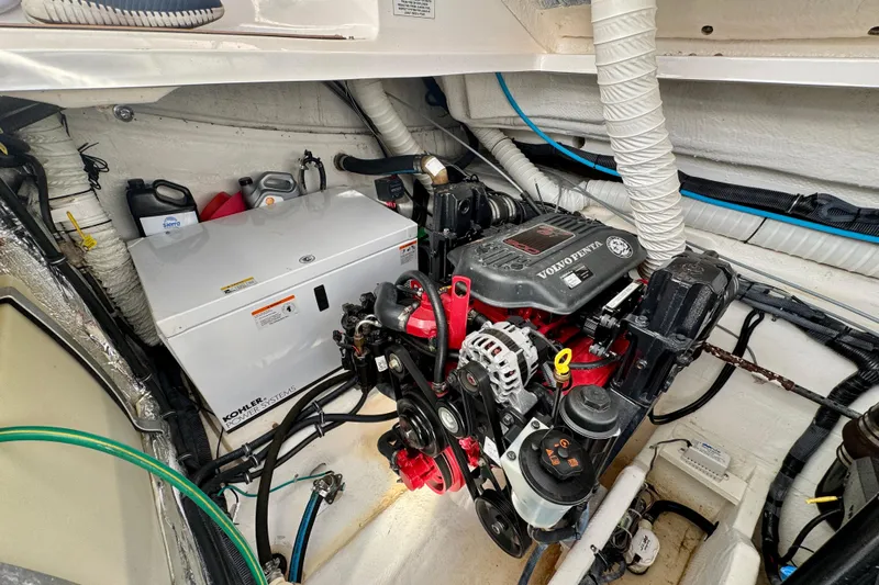 Escape Yacht Photos Pics Engine room of 2009 Rinker 360 Express Cruiser with Volvo Penta engine and Kohler power system.