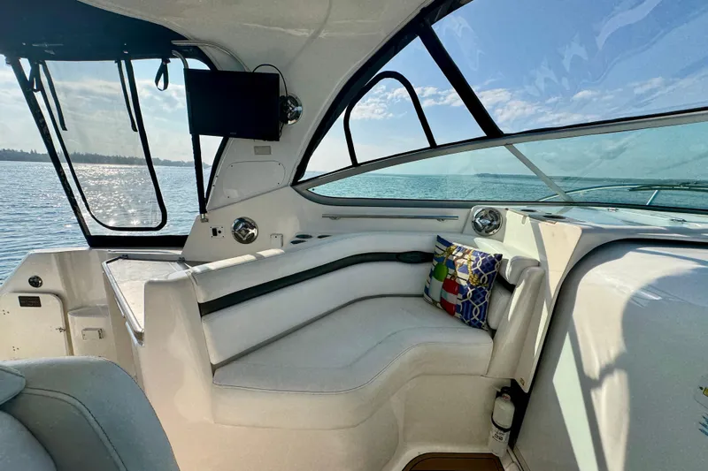 Escape Yacht Photos Pics 2009 Rinker 360 Express Cruiser interior with seating, TV, and ocean view.