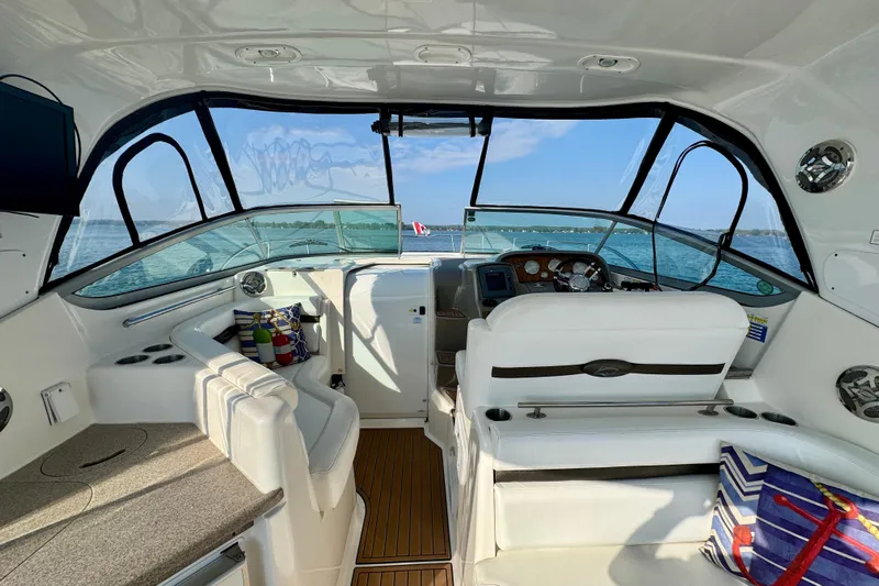 Escape Yacht Photos Pics 2009 Rinker 360 Express Cruiser interior with helm, seating, and lake view.