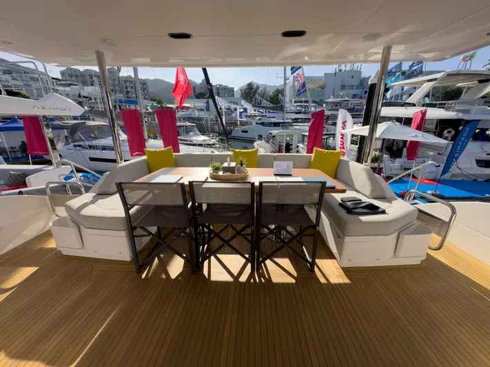  Yacht Photos Pics Luxurious Azimut GRANDE 25 METRI yacht deck with elegant seating and marina view.