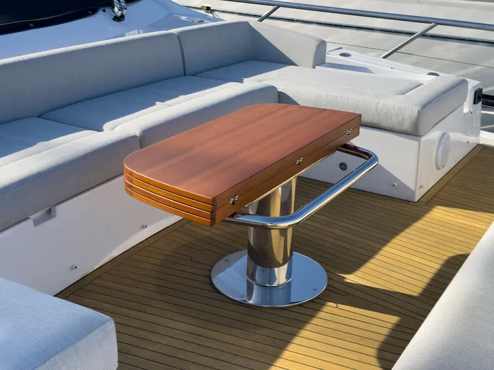  Yacht Photos Pics Luxury seating area on 2020 Azimut GRANDE 25 METRI yacht with wooden table.