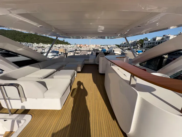  Yacht Photos Pics Luxurious 2020 Azimut GRANDE 25 METRI yacht deck with elegant seating and scenic marina view.