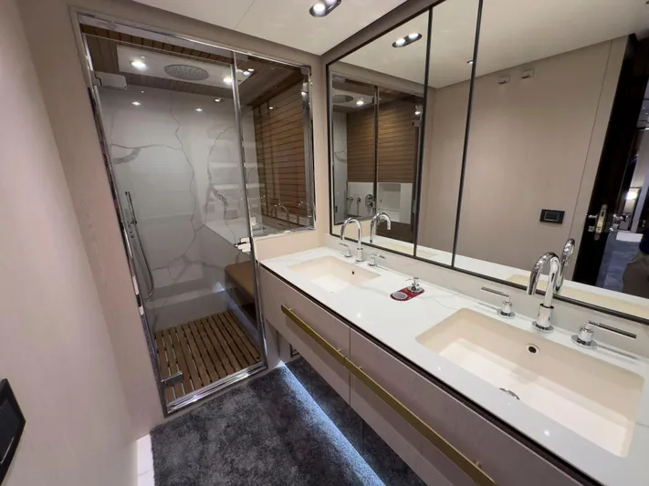  Yacht Photos Pics Luxurious bathroom in 2020 Azimut GRANDE 25 METRI yacht with dual sinks and glass shower.