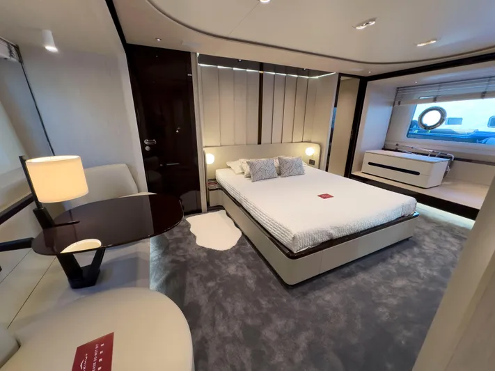 Yacht Photos Pics Luxurious bedroom interior of 2020 Azimut GRANDE 25 METRI yacht with modern furnishings.