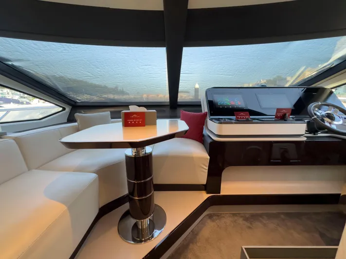  Yacht Photos Pics Luxurious interior of 2020 Azimut GRANDE 25 METRI yacht with modern helm and seating area.