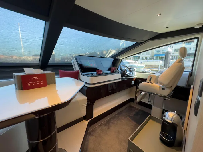  Yacht Photos Pics Luxurious interior of 2020 Azimut GRANDE 25 METRI yacht with modern helm and seating.