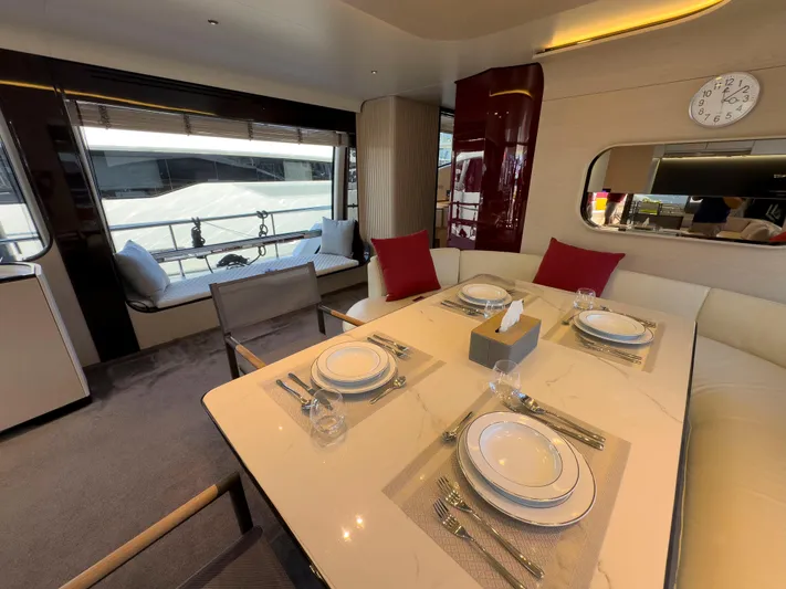  Yacht Photos Pics Luxurious dining area on 2020 Azimut GRANDE 25 METRI yacht, featuring elegant table settings.