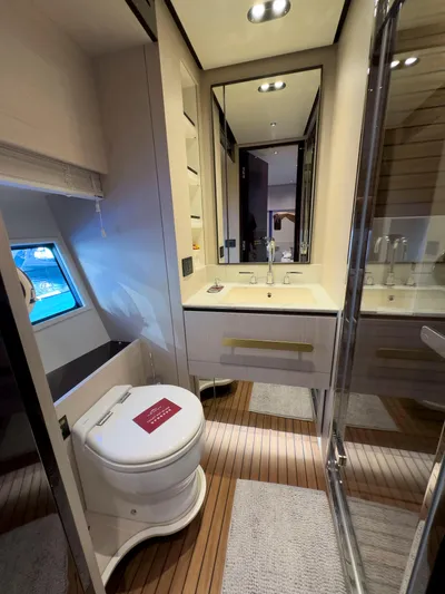  Yacht Photos Pics Luxurious bathroom in 2020 Azimut GRANDE 25 METRI yacht with modern fixtures and wooden flooring.