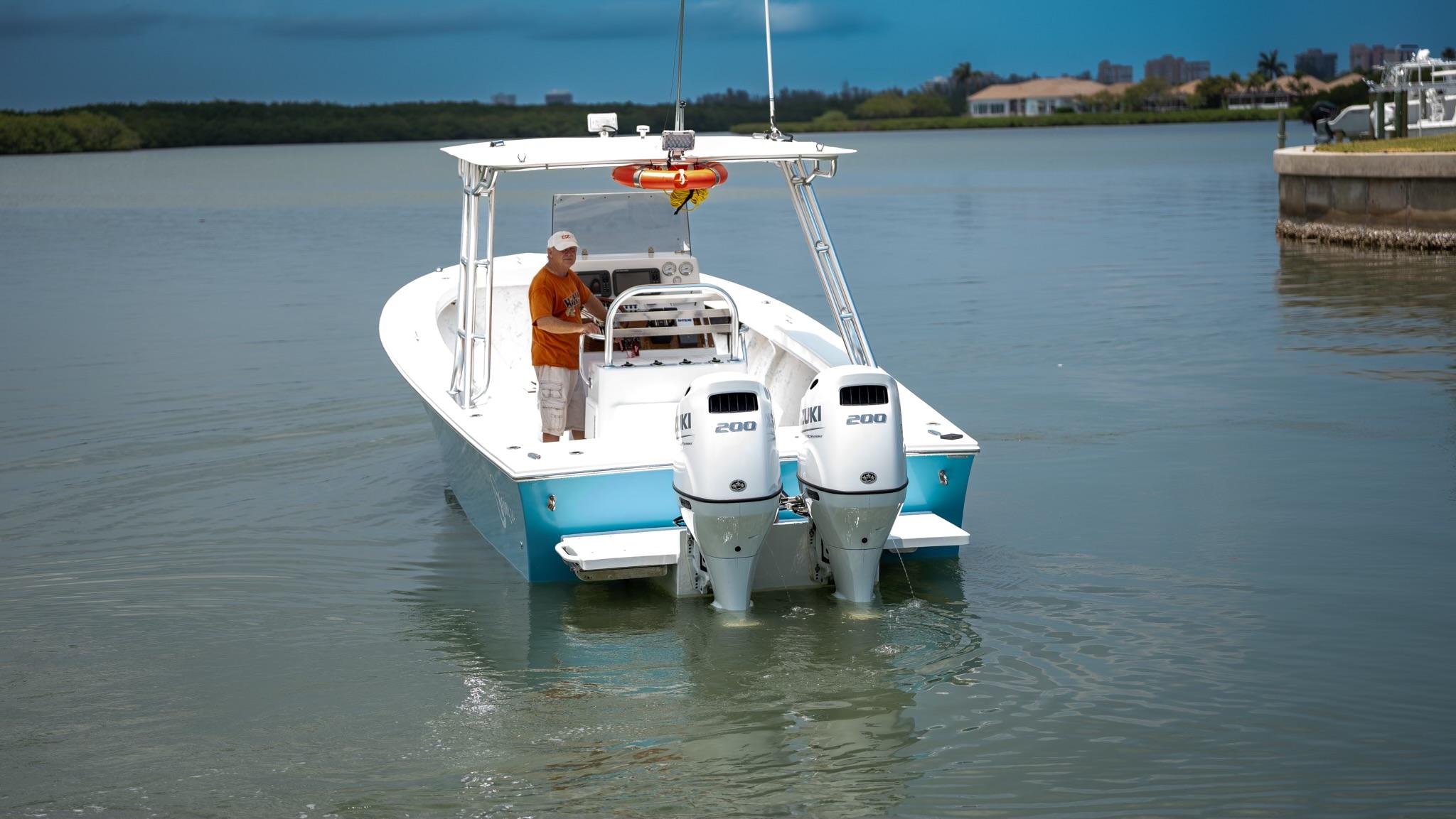 2021 C-Hawk 29CC boat with dual engines on calm water.