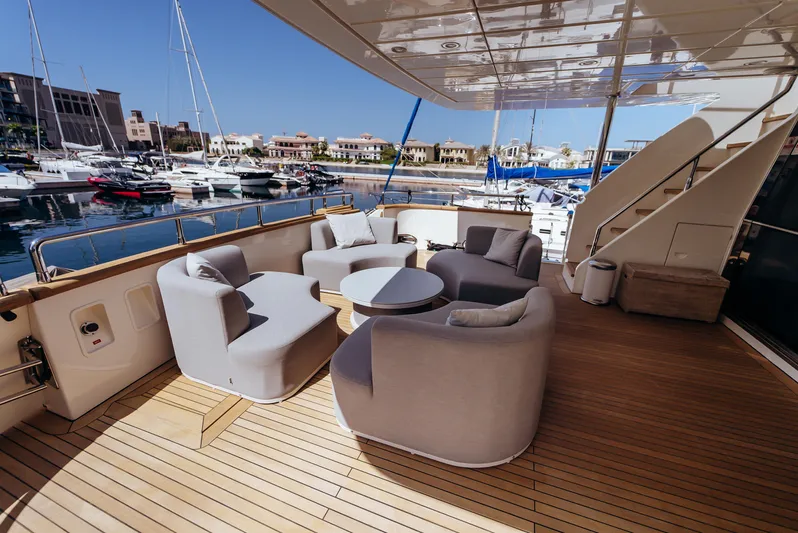 Apache Yacht Photos Pics Luxury yacht Falcon 86, 2004 model, with elegant outdoor seating on teak deck.