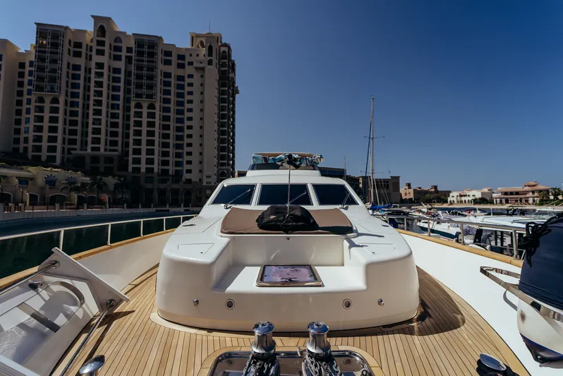 Apache Yacht Photos Pics Luxury Falcon 86 yacht docked at marina, 2004 model, with cityscape background.