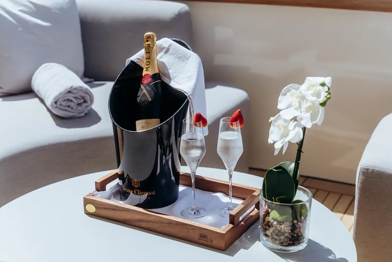 Apache Yacht Photos Pics Luxurious yacht setting with champagne, strawberries, and orchid on Falcon 86, 2004 model.