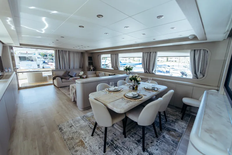 Apache Yacht Photos Pics Luxurious interior of a 2004 Falcon 86 yacht with elegant dining and seating areas.