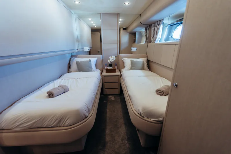 Apache Yacht Photos Pics Luxurious twin cabin interior on 2004 Falcon 86 yacht, featuring elegant bedding and decor.