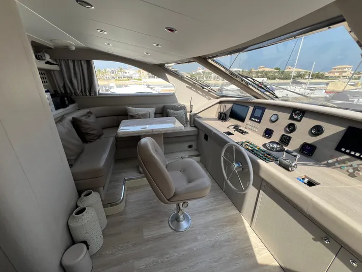 Apache Yacht Photos Pics Luxurious interior of a 2004 Falcon 86 yacht with modern helm and seating area.