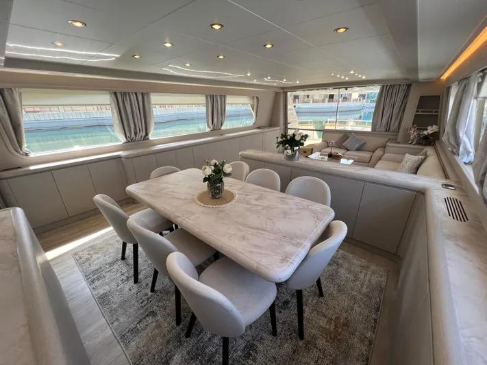 Apache Yacht Photos Pics Luxurious interior of 2004 Falcon 86 yacht with elegant dining and seating area.