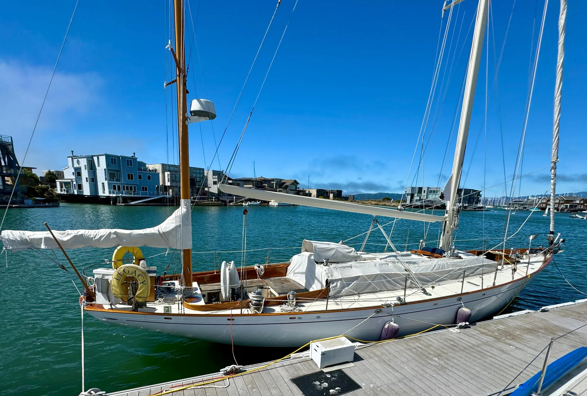 Aage Nielsen 50' Ketch, 1956, docked in a sunny marina.