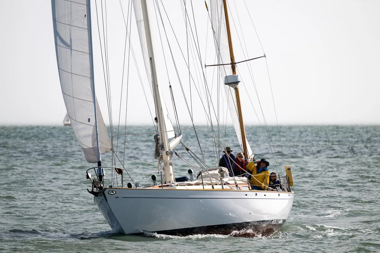 Aage Nielsen 50' Ketch sailing on open water, 1956 vintage yacht.