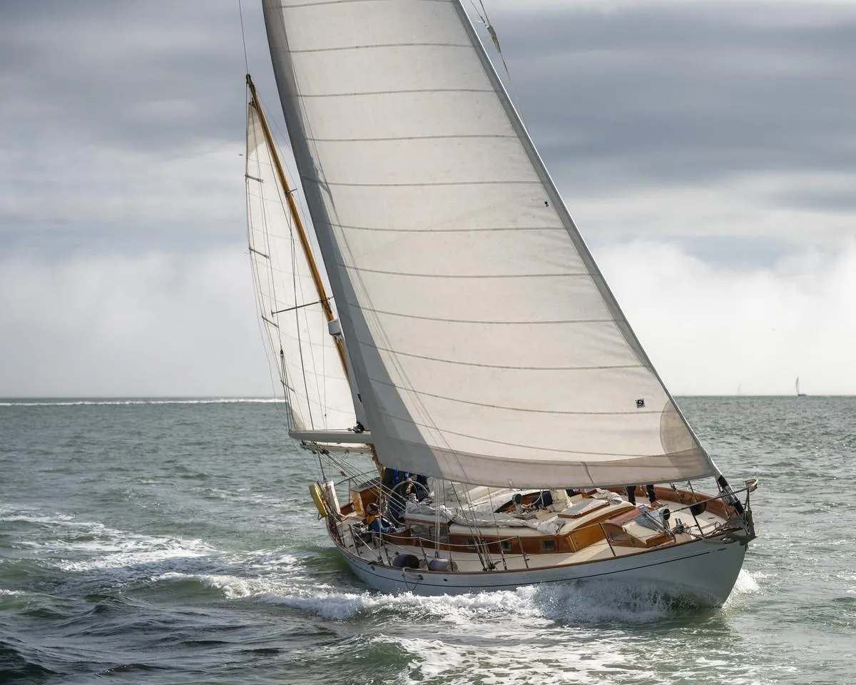 Aage Nielsen 50' Ketch sailing on open sea, 1956 vintage yacht.