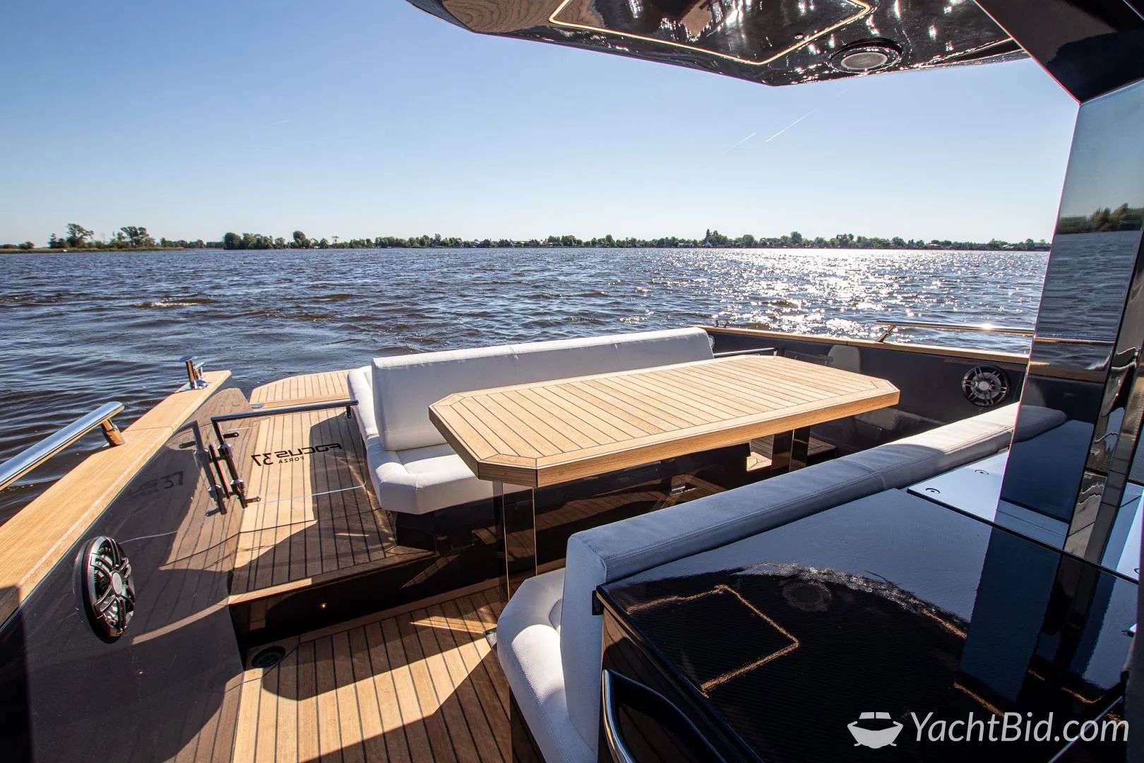 Luxurious deck of FOCUS FORZA 37 yacht, 2023 model, on calm waters.