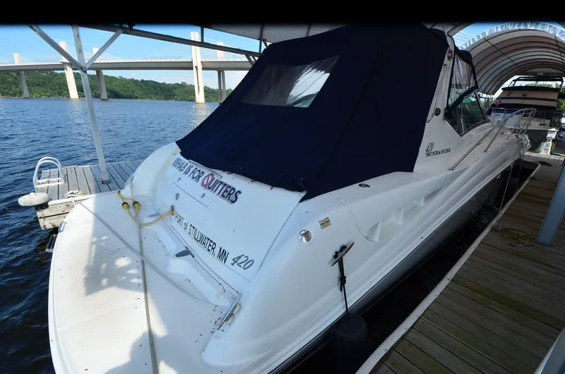 Rehab Is For Quitters Yacht Photos Pics 2003 Sea Ray 420 Sundancer docked, covered, with scenic bridge and water view.