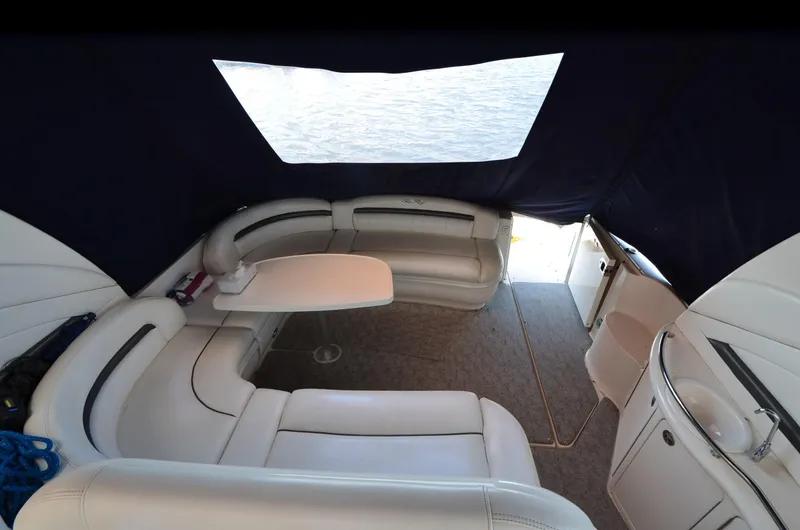 Rehab Is For Quitters Yacht Photos Pics Interior of 2003 Sea Ray 420 Sundancer yacht with seating and table.