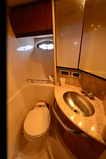 Rehab Is For Quitters Yacht Photos Pics Bathroom interior of 2003 Sea Ray 420 Sundancer yacht with sink and toilet.