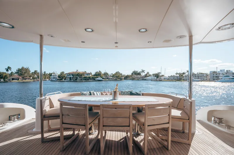 Lady Kristina Yacht Photos Pics Luxury yacht Lazzara LY106 2004, elegant deck dining area with waterfront view.