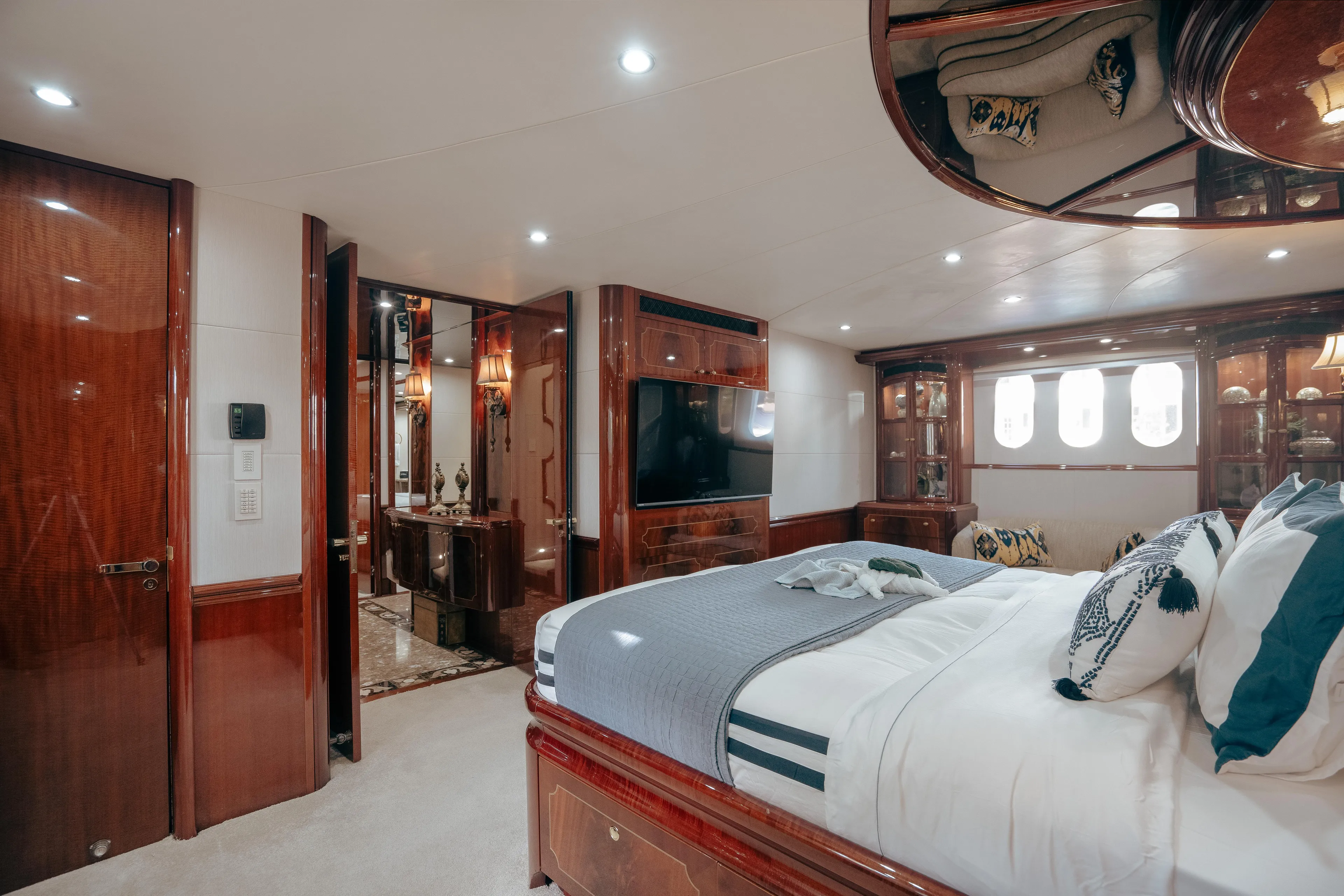 Lady Kristina Yacht Photos Pics Luxurious 2004 Lazzara LY106 yacht bedroom with elegant wood finishes and modern amenities.