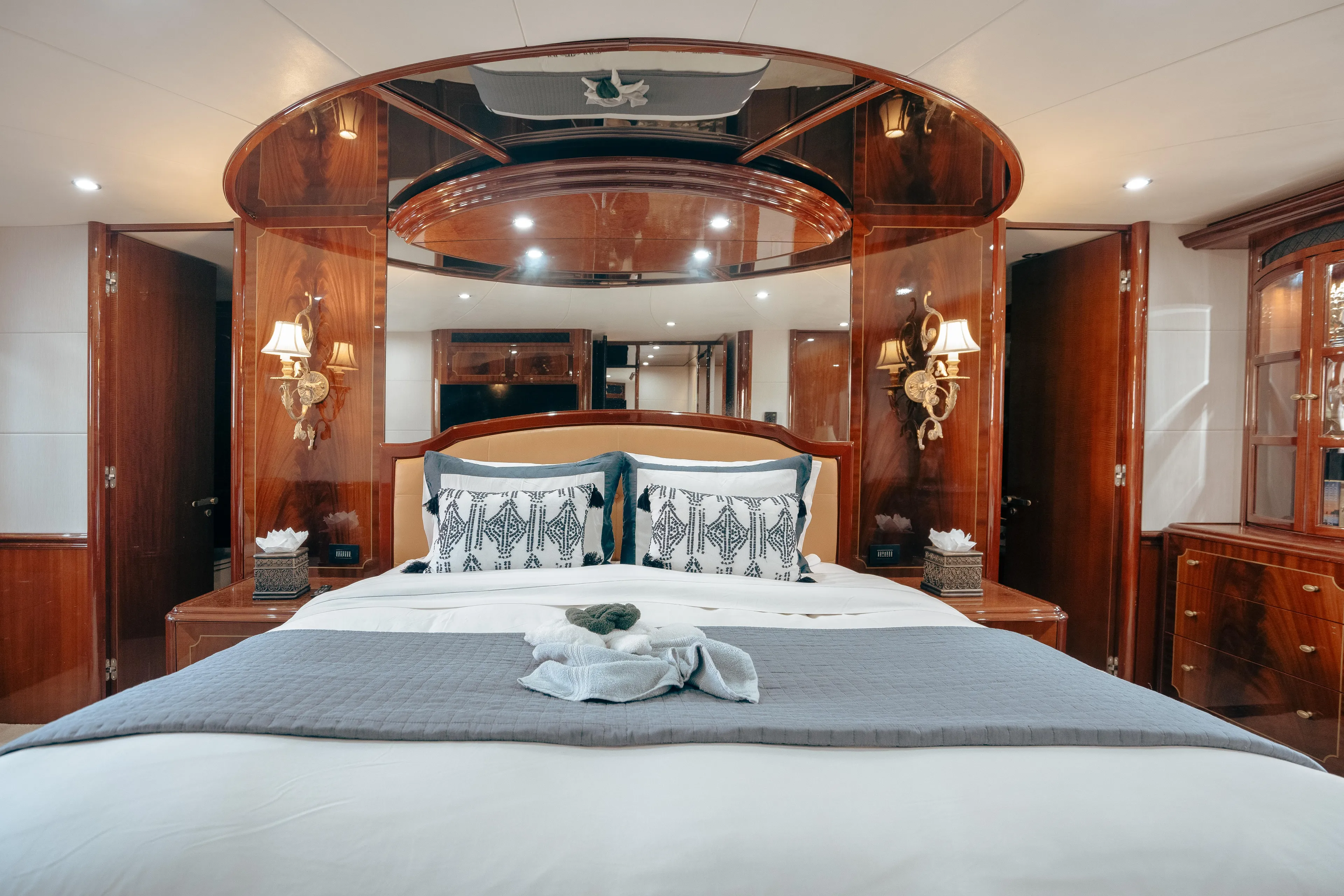 Lady Kristina Yacht Photos Pics Luxurious bedroom interior of 2004 Lazzara LY106 yacht with elegant wood finishes.