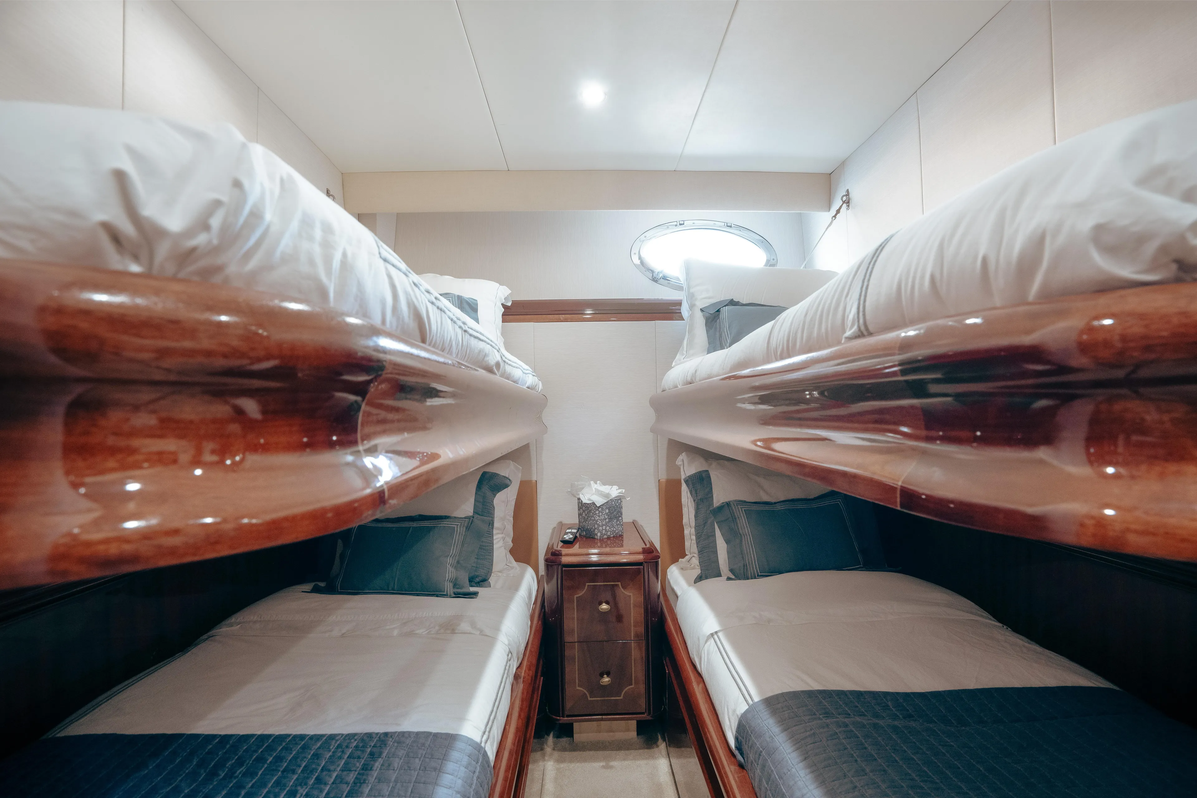 Lady Kristina Yacht Photos Pics Luxurious 2004 Lazzara LY106 yacht cabin with twin bunk beds and elegant wood finish.