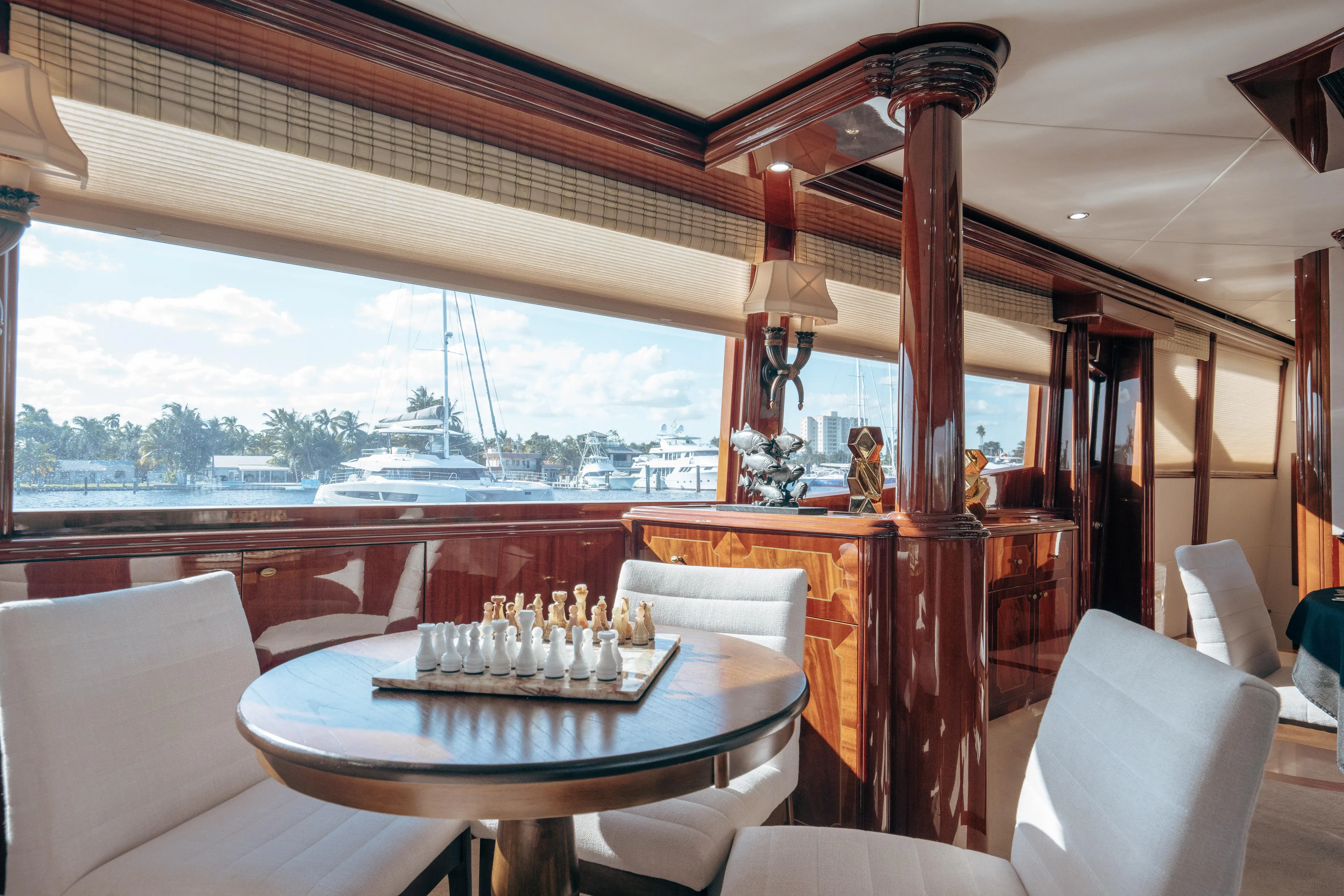 Lady Kristina Yacht Photos Pics Luxurious 2004 Lazzara LY106 yacht interior with chess set and elegant wood finishes.