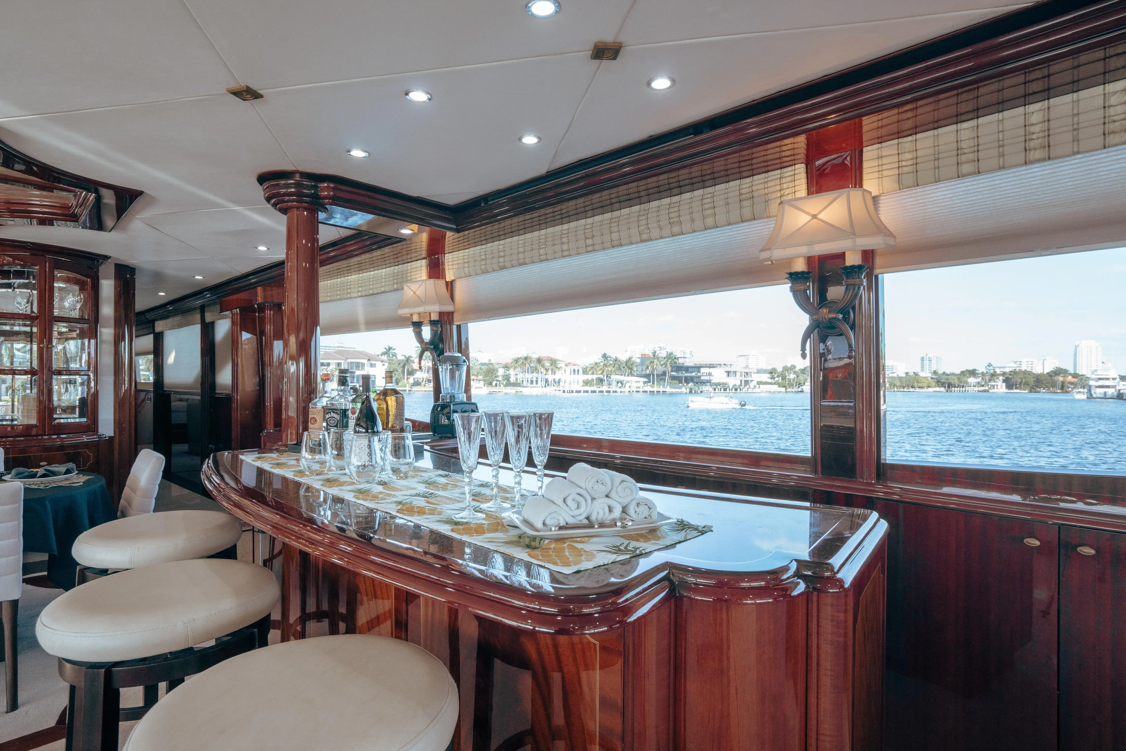 Lady Kristina Yacht Photos Pics Luxurious interior of 2004 Lazzara LY106 yacht with elegant bar and waterfront view.