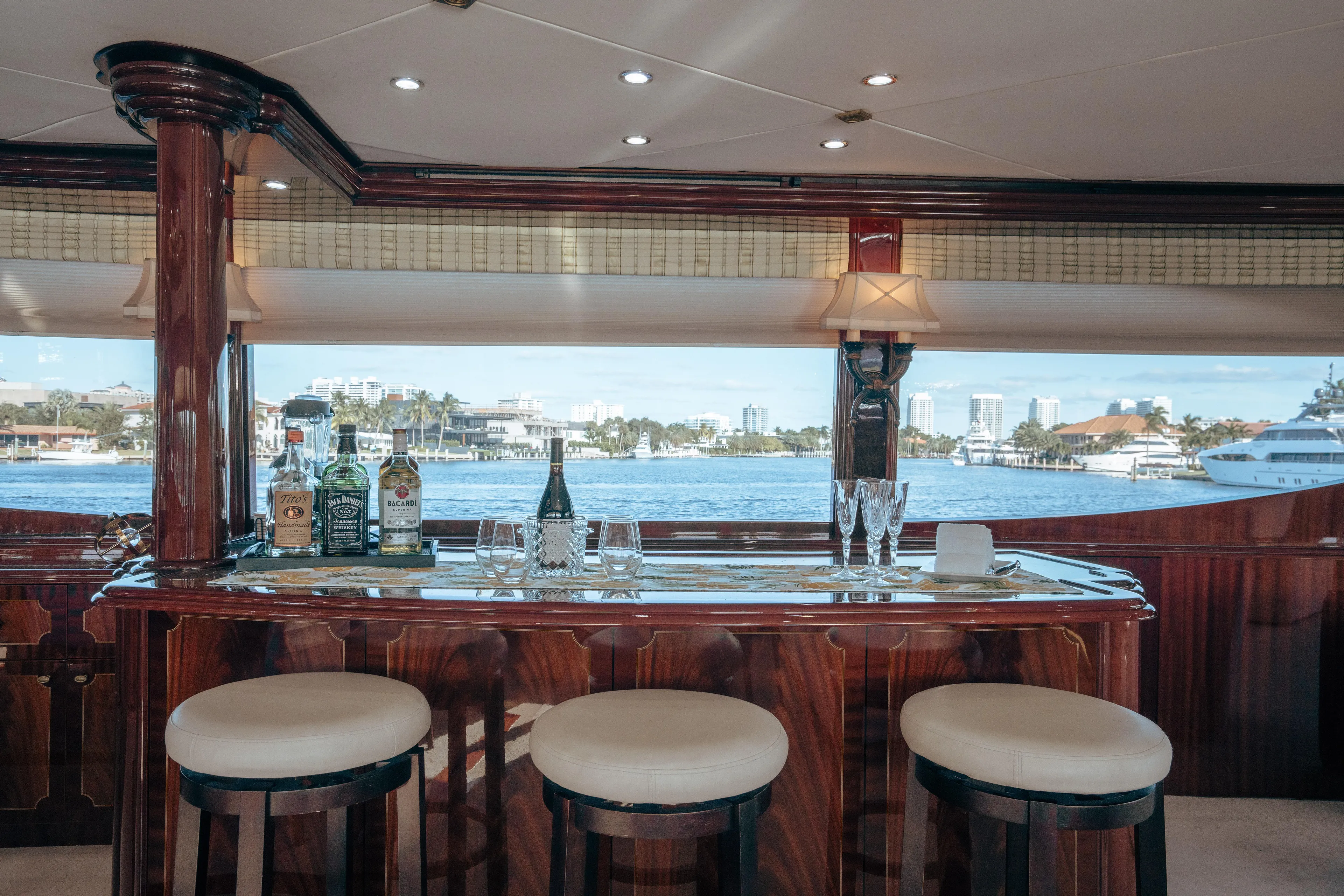 Lady Kristina Yacht Photos Pics Luxurious 2004 Lazzara LY106 yacht interior with elegant bar and waterfront view.