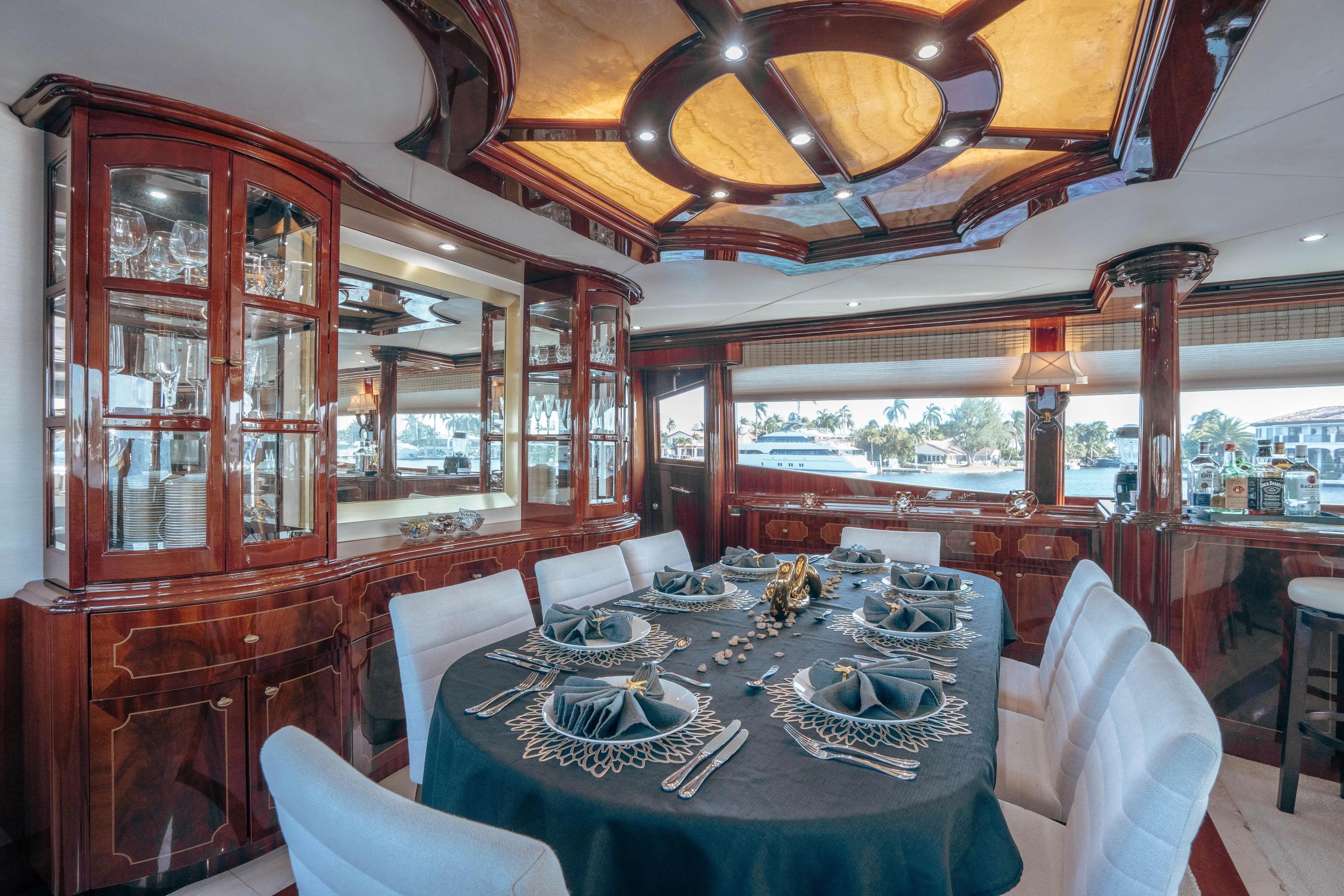 Lady Kristina Yacht Photos Pics Luxurious dining area on 2004 Lazzara LY106 yacht with elegant table setting.
