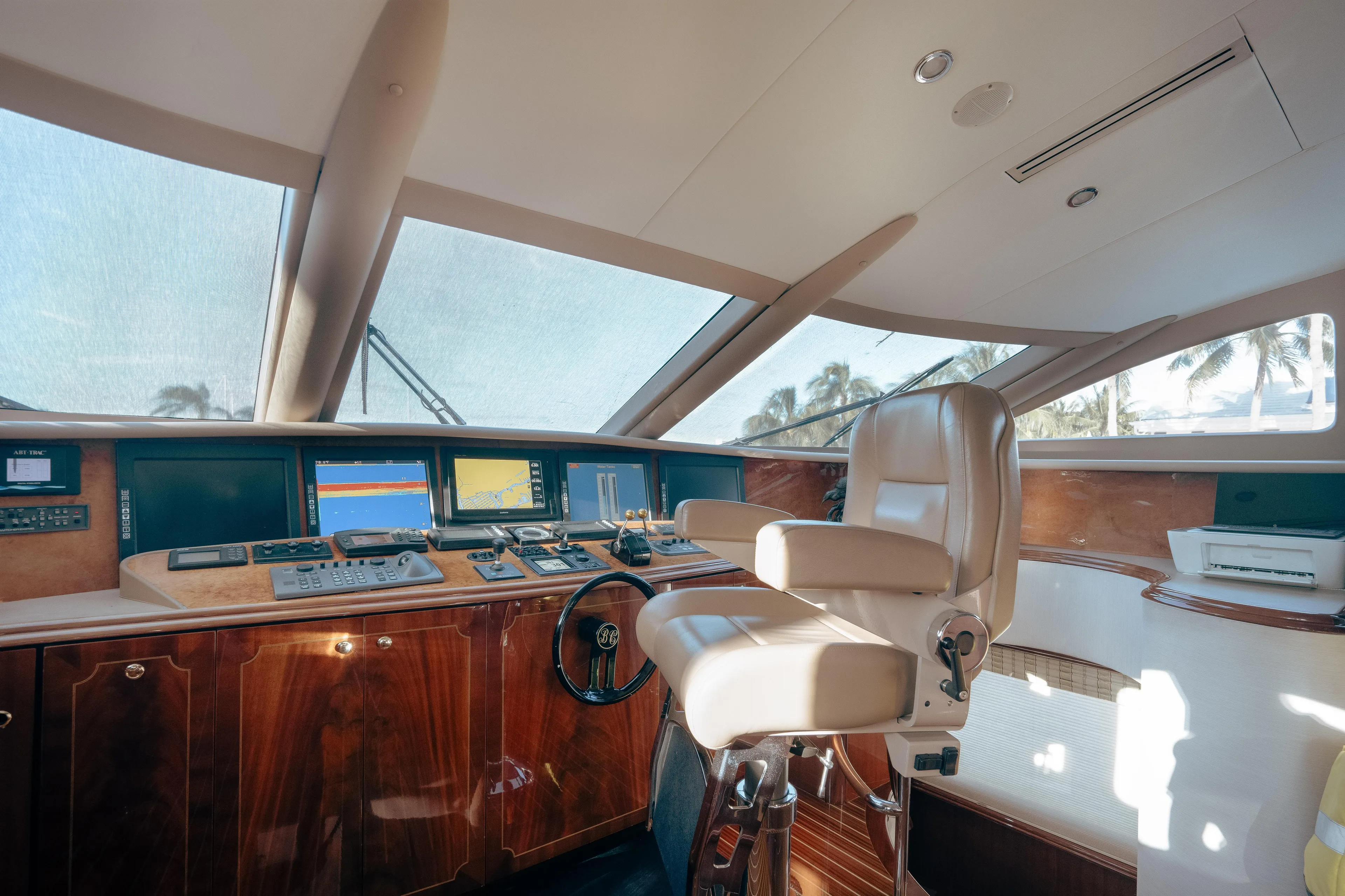 Lady Kristina Yacht Photos Pics Luxurious 2004 Lazzara LY106 yacht helm with leather captain's chair and advanced navigation systems.