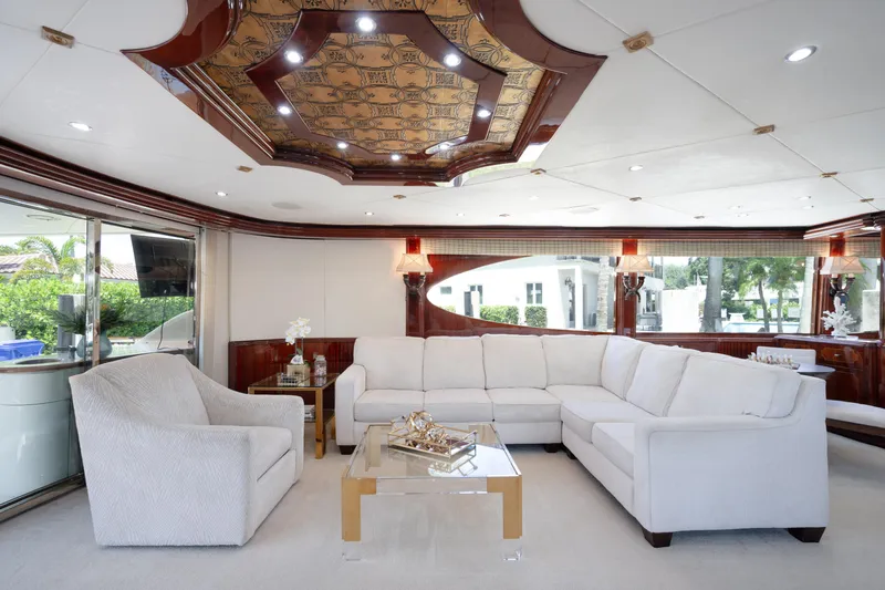 Lady Kristina Yacht Photos Pics Luxurious interior of 2004 Lazzara LY106 yacht with elegant white seating and ornate ceiling design.