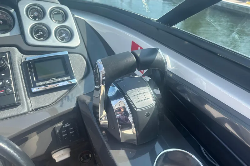  Yacht Photos Pics Control panel of a 2018 Monterey 328SS Super Sport boat with gauges and throttle.