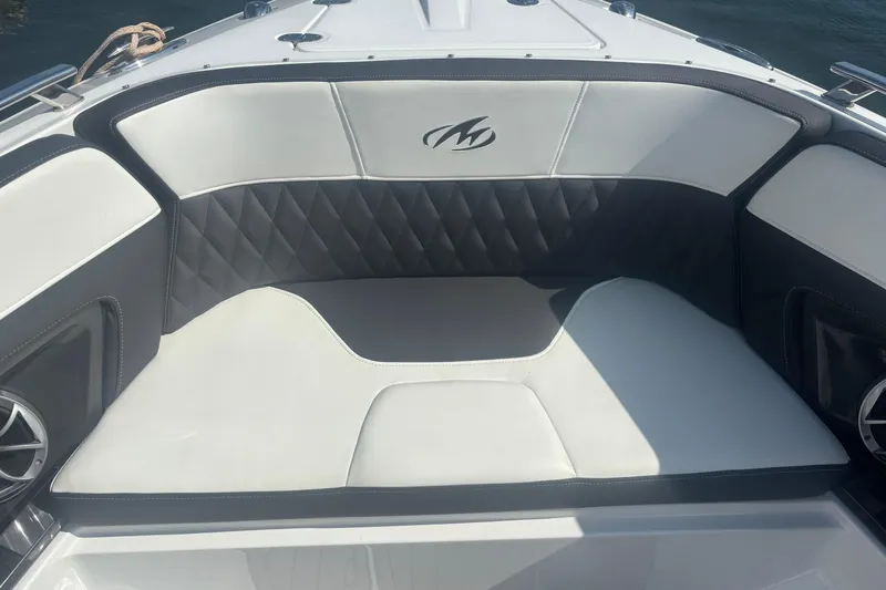  Yacht Photos Pics 2018 Monterey 328SS Super Sport boat interior with cushioned seating and logo.