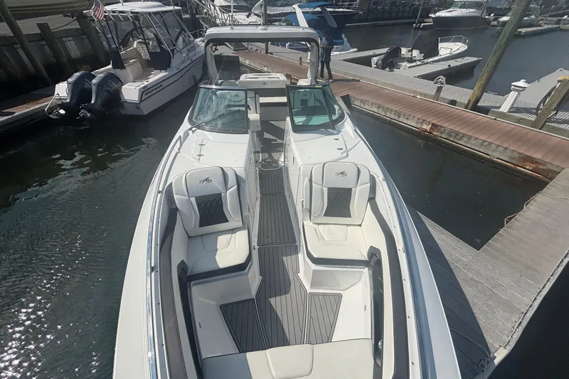  Yacht Photos Pics 2018 Monterey 328SS Super Sport boat docked at marina, featuring sleek design and spacious seating.