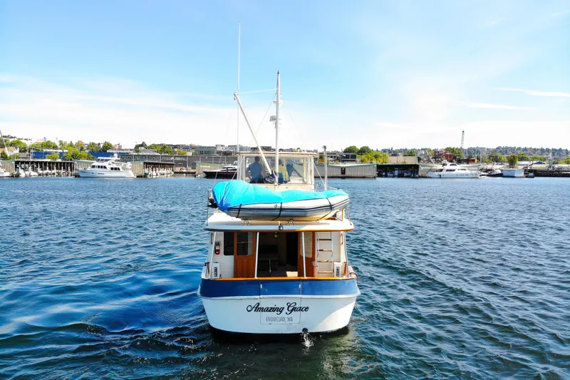 Amazing Grace Yacht Photos Pics 1983 Kadey-Krogen Manatee 36 boat named "Amazing Grace" on a sunny waterfront.