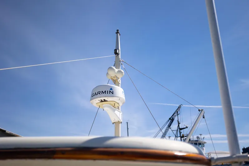 Amazing Grace Yacht Photos Pics Radar equipment on 1983 Kadey-Krogen Manatee 36 boat under clear blue sky.