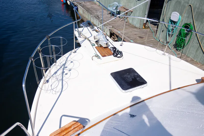 Amazing Grace Yacht Photos Pics 1983 Kadey-Krogen Manatee 36 yacht deck with railing and dockside view.