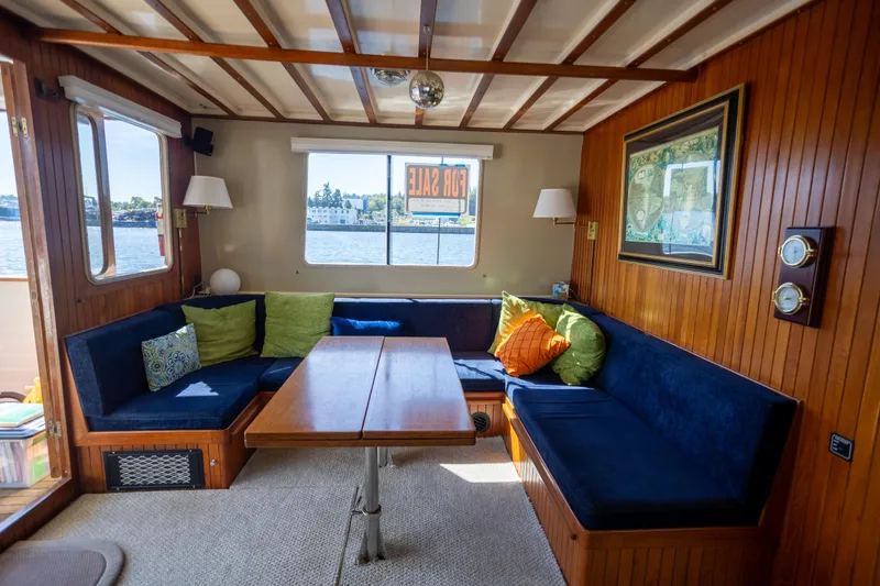Amazing Grace Yacht Photos Pics Interior of 1983 Kadey-Krogen Manatee 36 yacht with cozy seating and wooden decor.